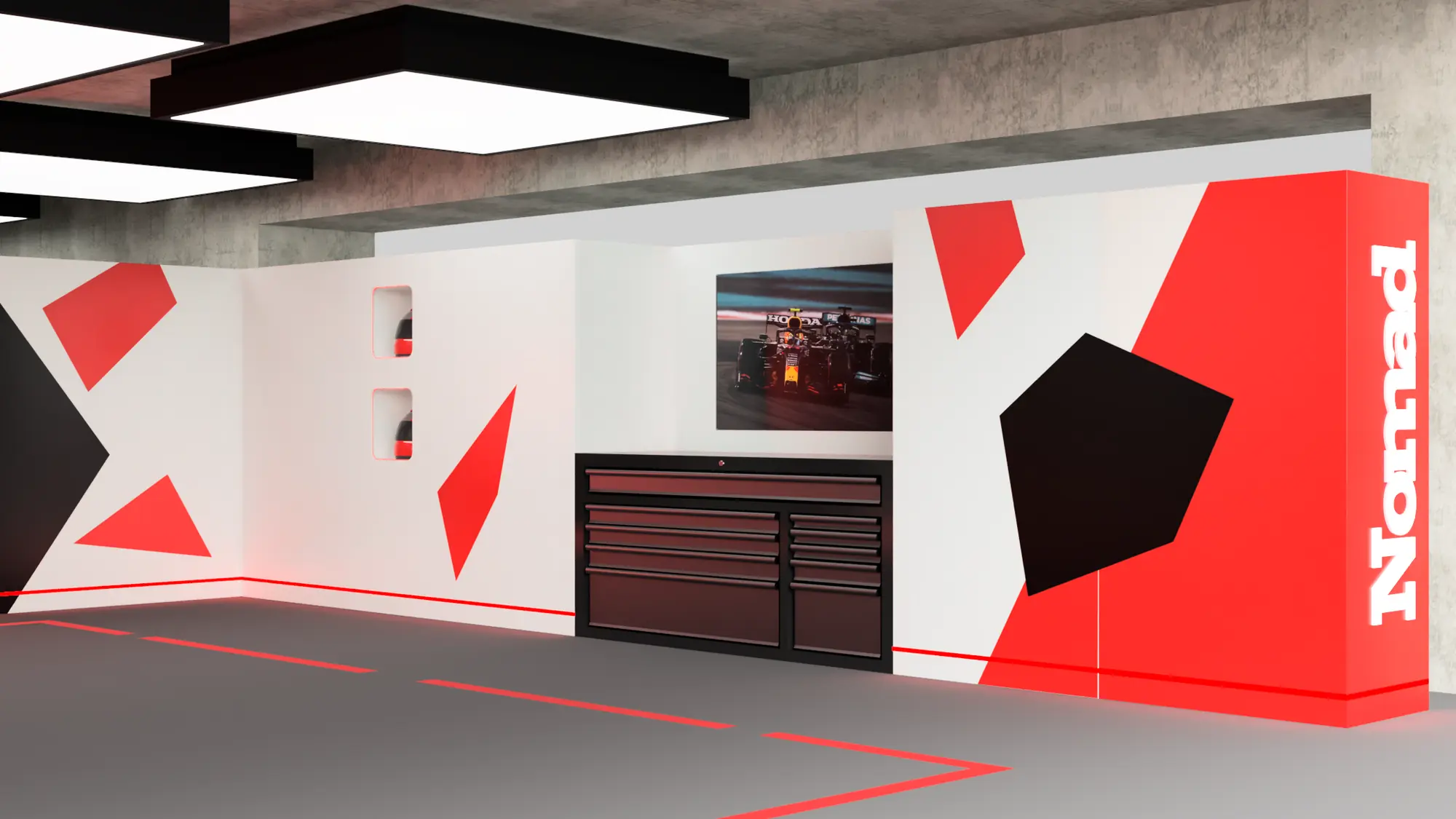 A motorsport pit garage built from Nomad Walling modular panels in red, white and black.